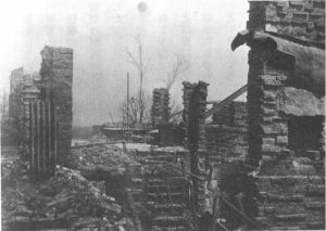 Photograph looking across the main floor after Taliesin II was destroyed by fire in 1925.