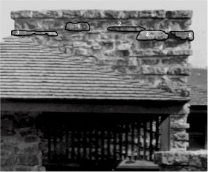 A photograph of the chimney at Taliesin's porte-cochere in 1913-14.