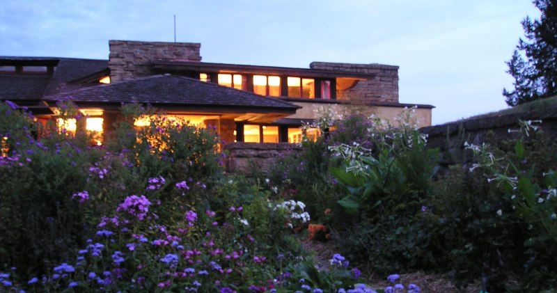 Looking at the east facade of Taliesin at dusk.
