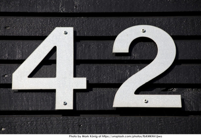 The number "42" on a black background. By Mark Konig at https://unsplash.com/photos/fbKMKNVJjwo