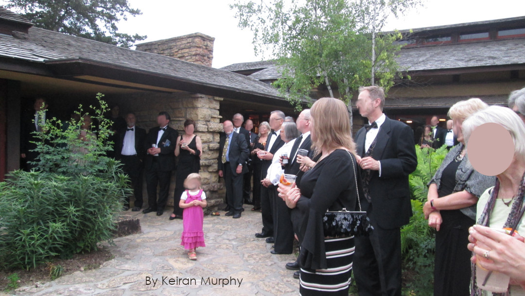 Photograph by Keiran Murphy of people at Taliesin's Garden Court during the 2019 Frank Lloyd Wright birthday formal.