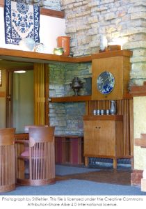 Photograph of the Taliesin Living Room with wooden built-in furniture and limestone on the walls. This file is licensed under the Creative Commons Attribution-Share Alike 4.0 International license.